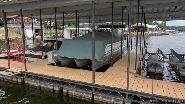 view of dock featuring a water view and boat lift