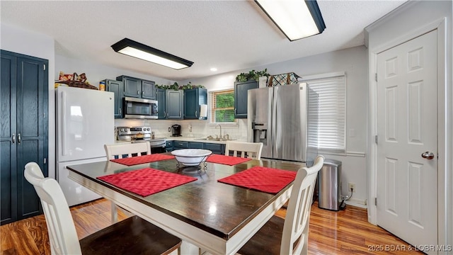 dining space featuring light wood-style flooring