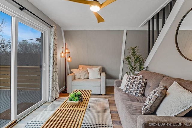 living area featuring ceiling fan and wood finished floors