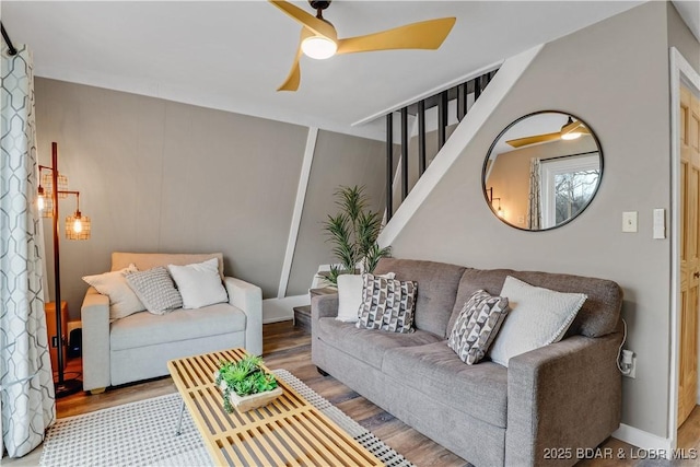 living area featuring ceiling fan and wood finished floors