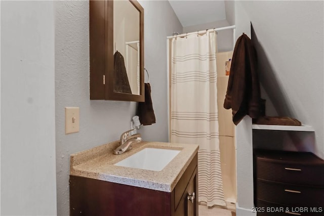 full bathroom featuring vanity and a shower with curtain