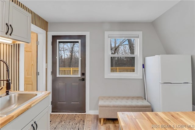 doorway featuring a sink