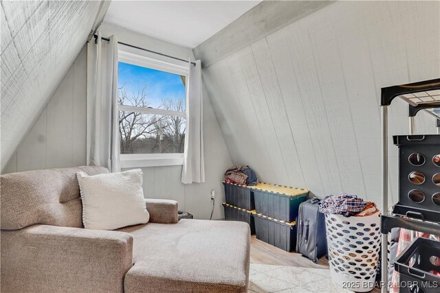 sitting room featuring lofted ceiling