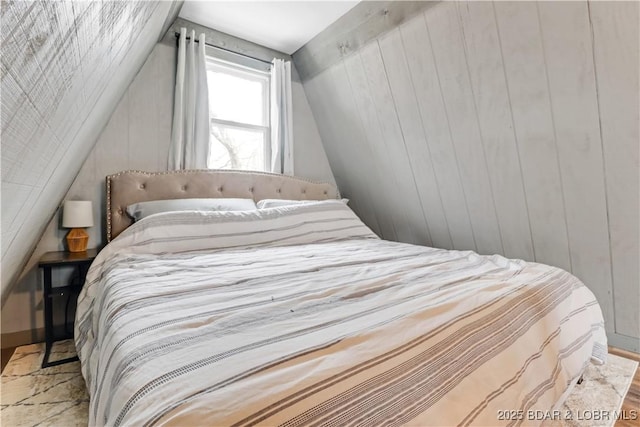 bedroom featuring lofted ceiling