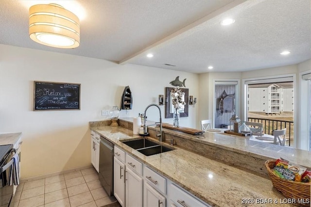 488 Regatta Bay Dr Unit 2C, Lake Ozark, MO 65049 - kitchen with stainless steel appliances, white cabinets, light stone countertops, recessed lighting, and a textured ceiling