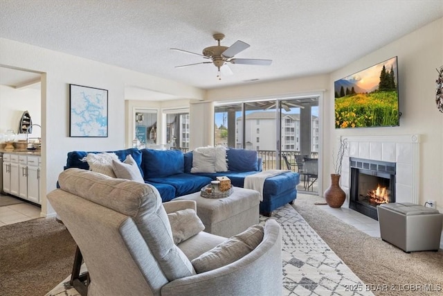 488 Regatta Bay Dr Unit 2C, Lake Ozark, MO 65049 - living area featuring a ceiling fan, light carpet, a fireplace, and a textured ceiling