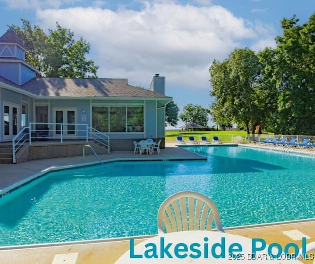 488 Regatta Bay Dr Unit 2C, Lake Ozark, MO 65049 - community pool with french doors and a patio area