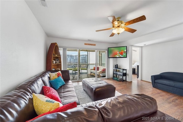 living room featuring wood finished floors and ceiling fan