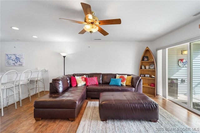 living area featuring recessed lighting, visible vents, wood finished floors, and ceiling fan