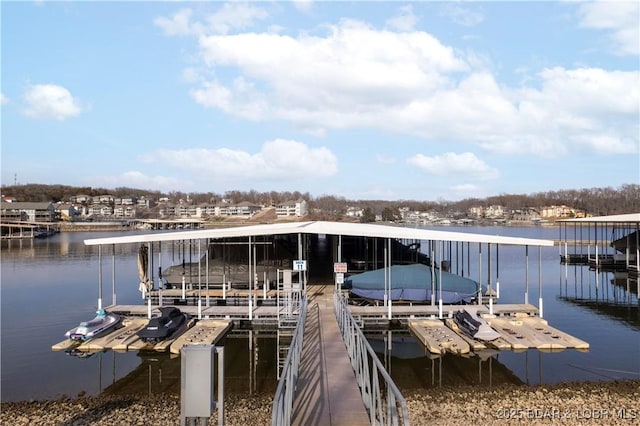 dock area featuring a water view and boat lift