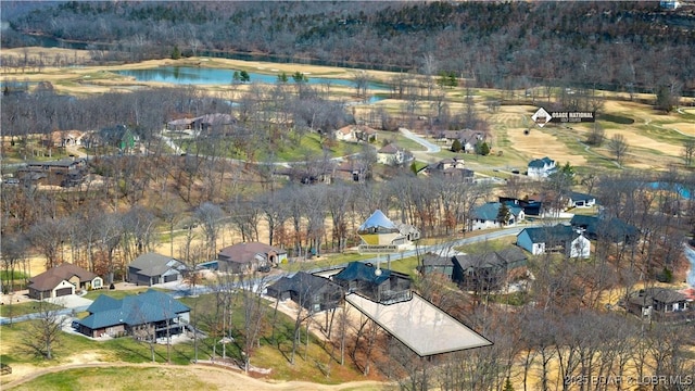 bird's eye view featuring a residential view and a water view