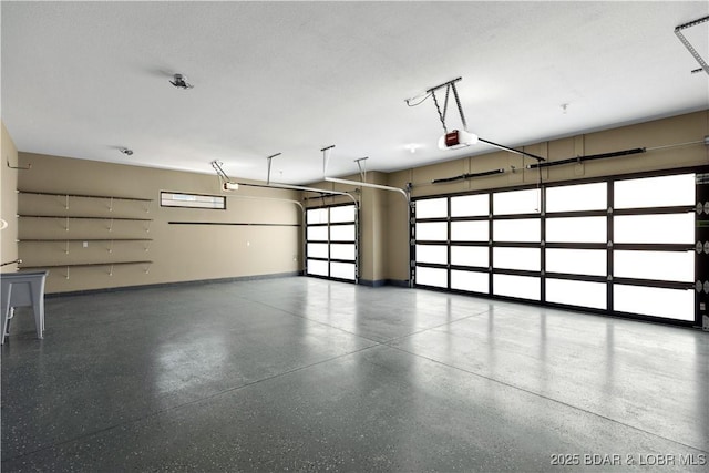 garage with baseboards and a garage door opener