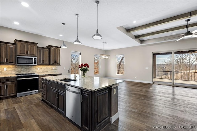 kitchen featuring backsplash, baseboards, dark wood finished floors, appliances with stainless steel finishes, and a sink