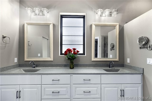 bathroom with a sink and double vanity