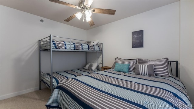 bedroom featuring carpet flooring, a ceiling fan, and baseboards