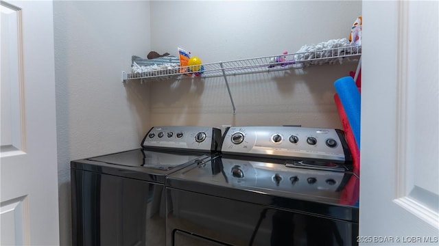 laundry area with laundry area and washing machine and dryer