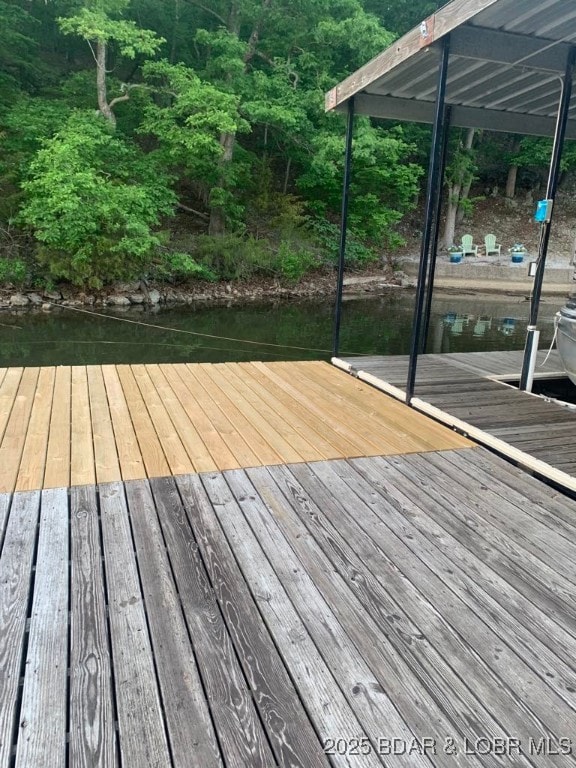 wooden deck with a water view