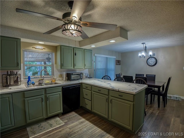 kitchen with a peninsula, a sink, green cabinets, black dishwasher, and light countertops