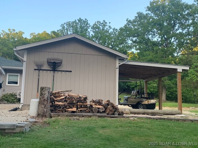 view of outdoor structure featuring an attached carport