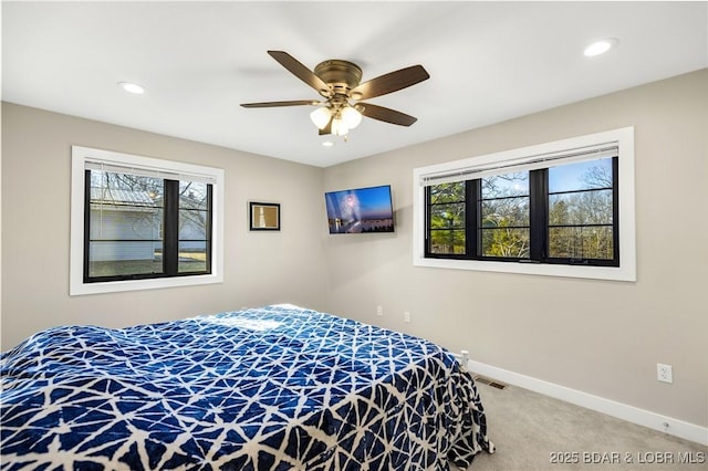 bedroom with visible vents, baseboards, light colored carpet, recessed lighting, and a ceiling fan