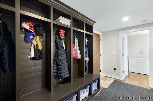 mudroom featuring recessed lighting, baseboards, and wood finished floors