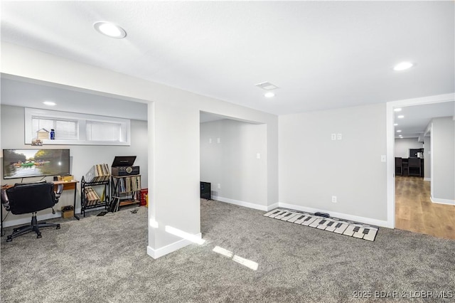 interior space featuring recessed lighting, baseboards, and carpet floors