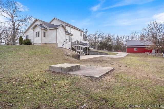 exterior space with stairs and a patio