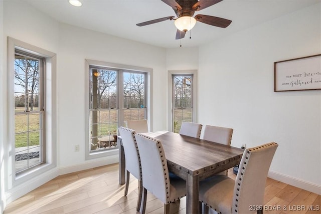 dining room with ceiling fan, recessed lighting, light wood-type flooring, and baseboards