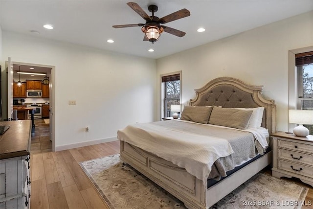 bedroom featuring light wood-style flooring, baseboards, a ceiling fan, and recessed lighting