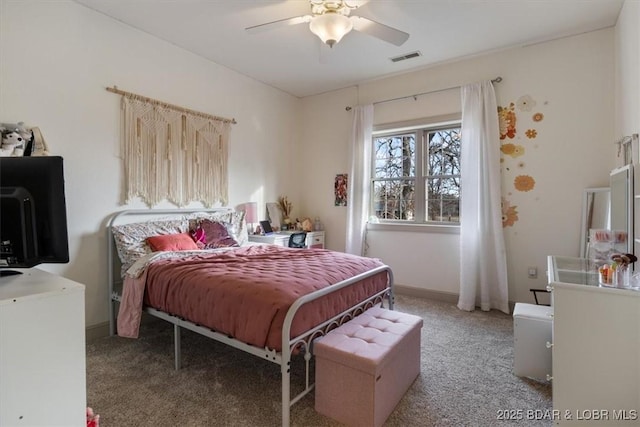 bedroom with carpet floors, baseboards, visible vents, and a ceiling fan