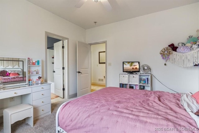 bedroom featuring light carpet, ceiling fan, and visible vents