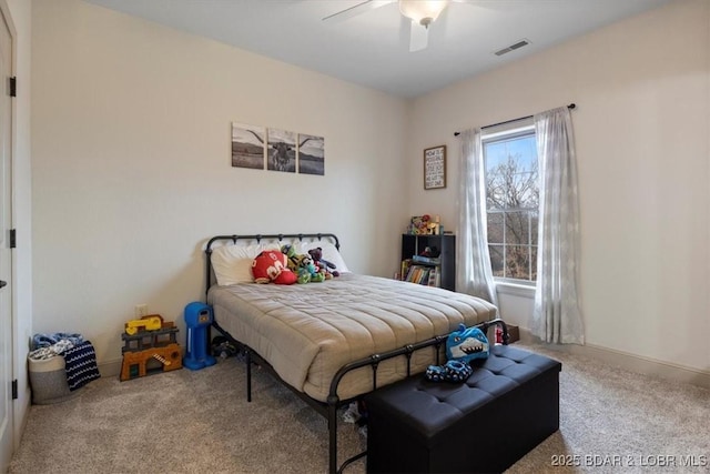 bedroom featuring a ceiling fan, baseboards, visible vents, and carpet flooring