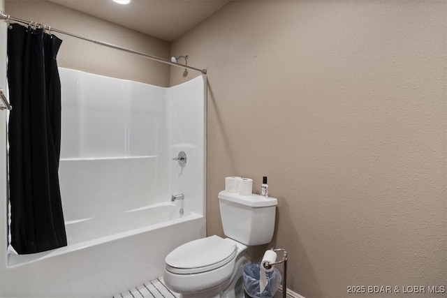 full bathroom with toilet and shower / bath combination with curtain