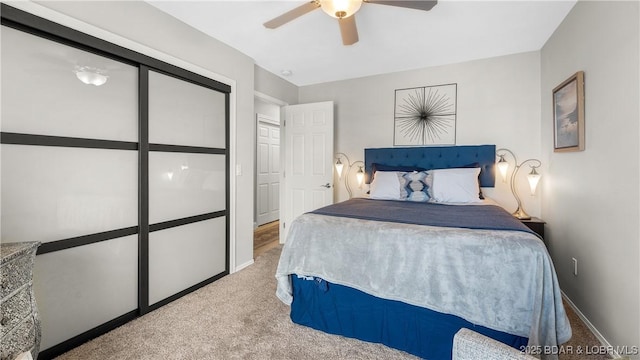 bedroom featuring baseboards, ceiling fan, and carpet flooring