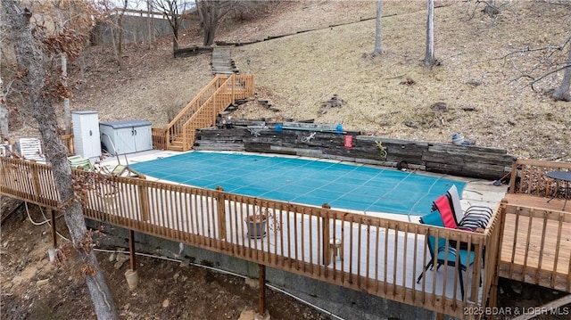 view of pool with stairway and a fenced in pool