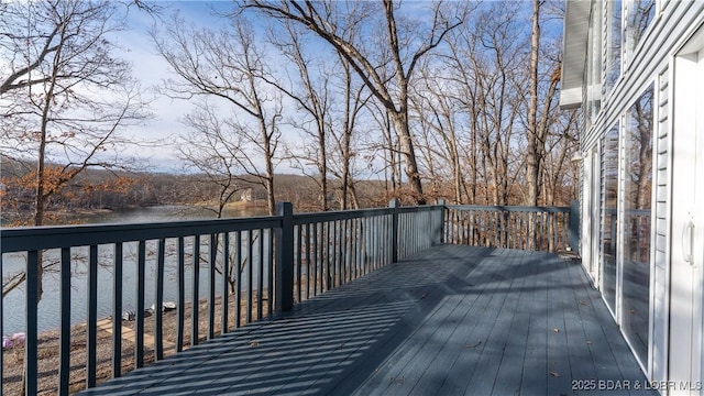 wooden deck featuring a water view