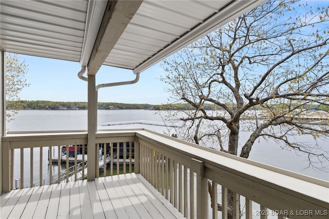 wooden deck featuring a water view