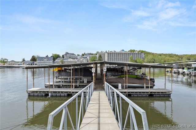 dock area featuring a water view and boat lift