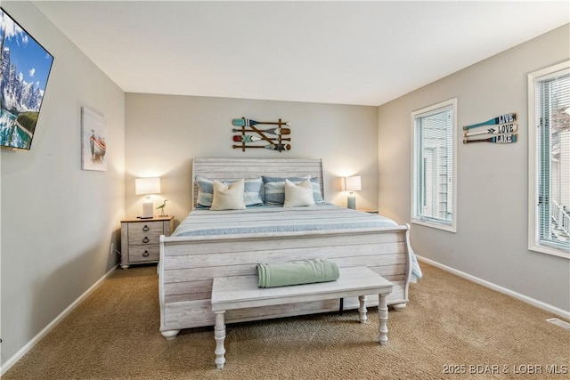 bedroom with carpet floors and baseboards