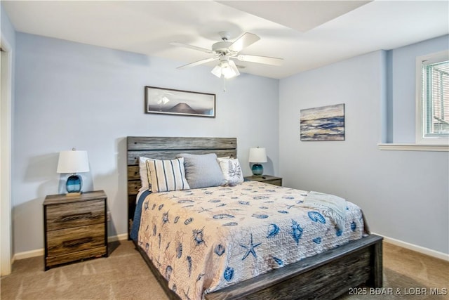 bedroom featuring carpet floors, a ceiling fan, and baseboards