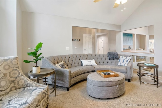 carpeted living room featuring high vaulted ceiling and ceiling fan