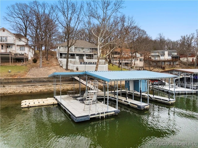 view of dock with a water view, boat lift, and a residential view