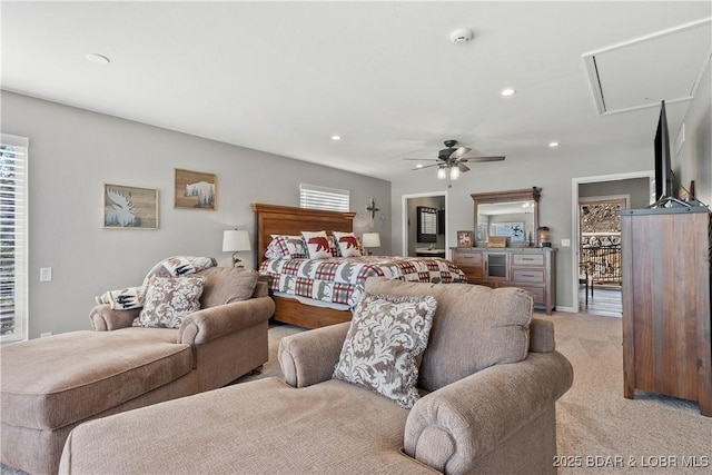 bedroom with recessed lighting, light colored carpet, attic access, ceiling fan, and baseboards