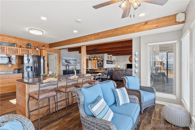 living area featuring dark wood-style floors, ceiling fan, beam ceiling, and recessed lighting