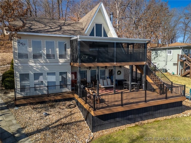 back of house featuring a sunroom, ceiling fan, stairs, a deck, and cooling unit