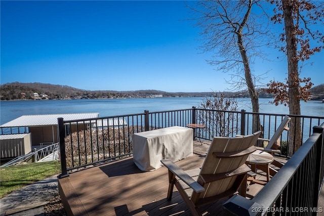 wooden terrace with a water view