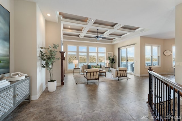 tiled living room with a ceiling fan, visible vents, baseboards, coffered ceiling, and beamed ceiling