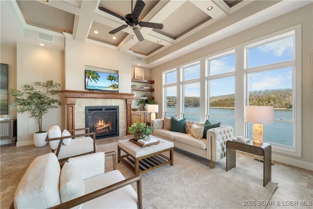 living room featuring visible vents, coffered ceiling, a high ceiling, a high end fireplace, and a wealth of natural light