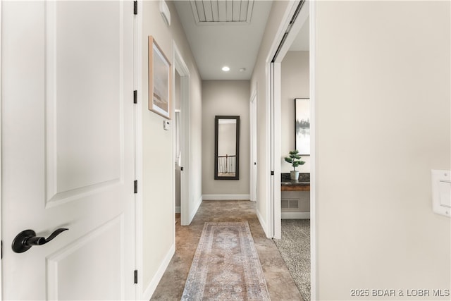 corridor featuring recessed lighting, visible vents, baseboards, and light carpet