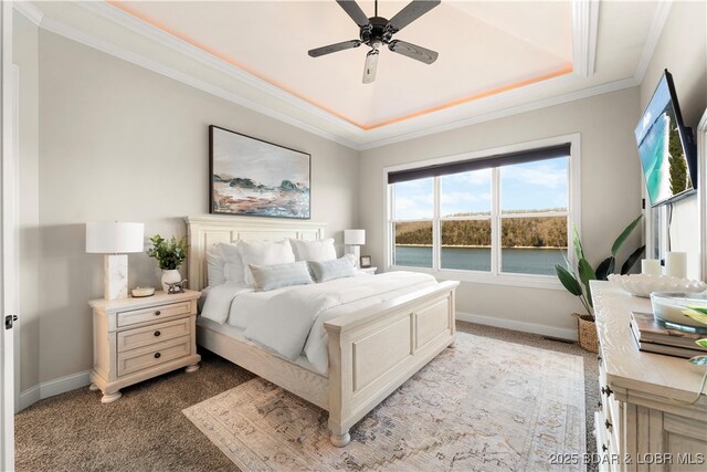 bedroom with a ceiling fan, baseboards, light colored carpet, and crown molding